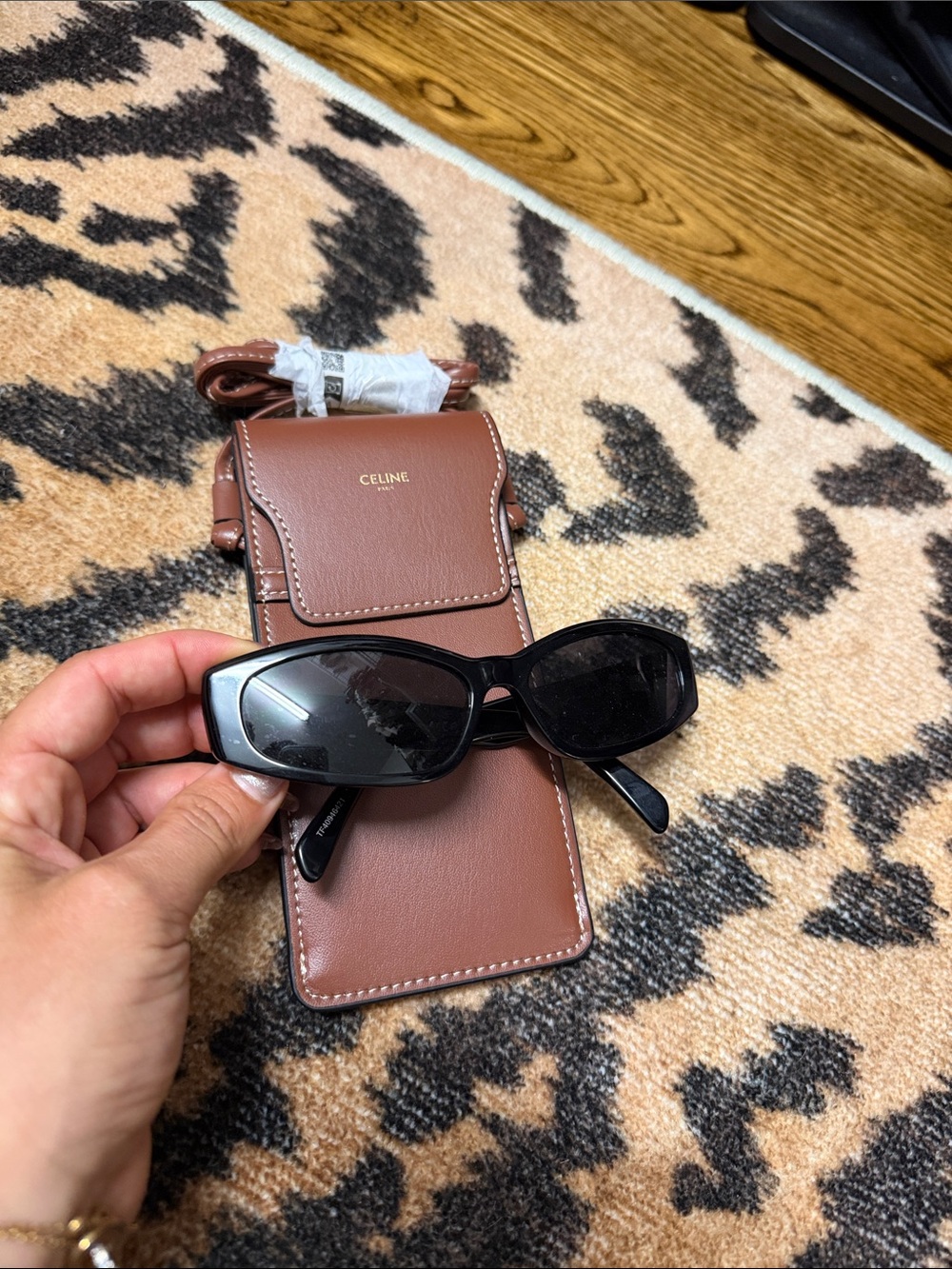 Celine CL40277I sunglasses in black with a prominent silver Triomphe logo hinge.